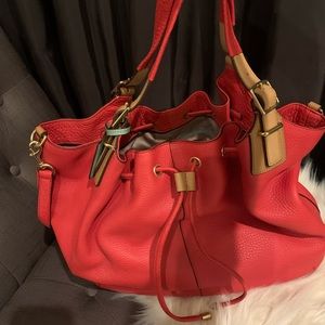 Coach handbag/ cross body in orange color.